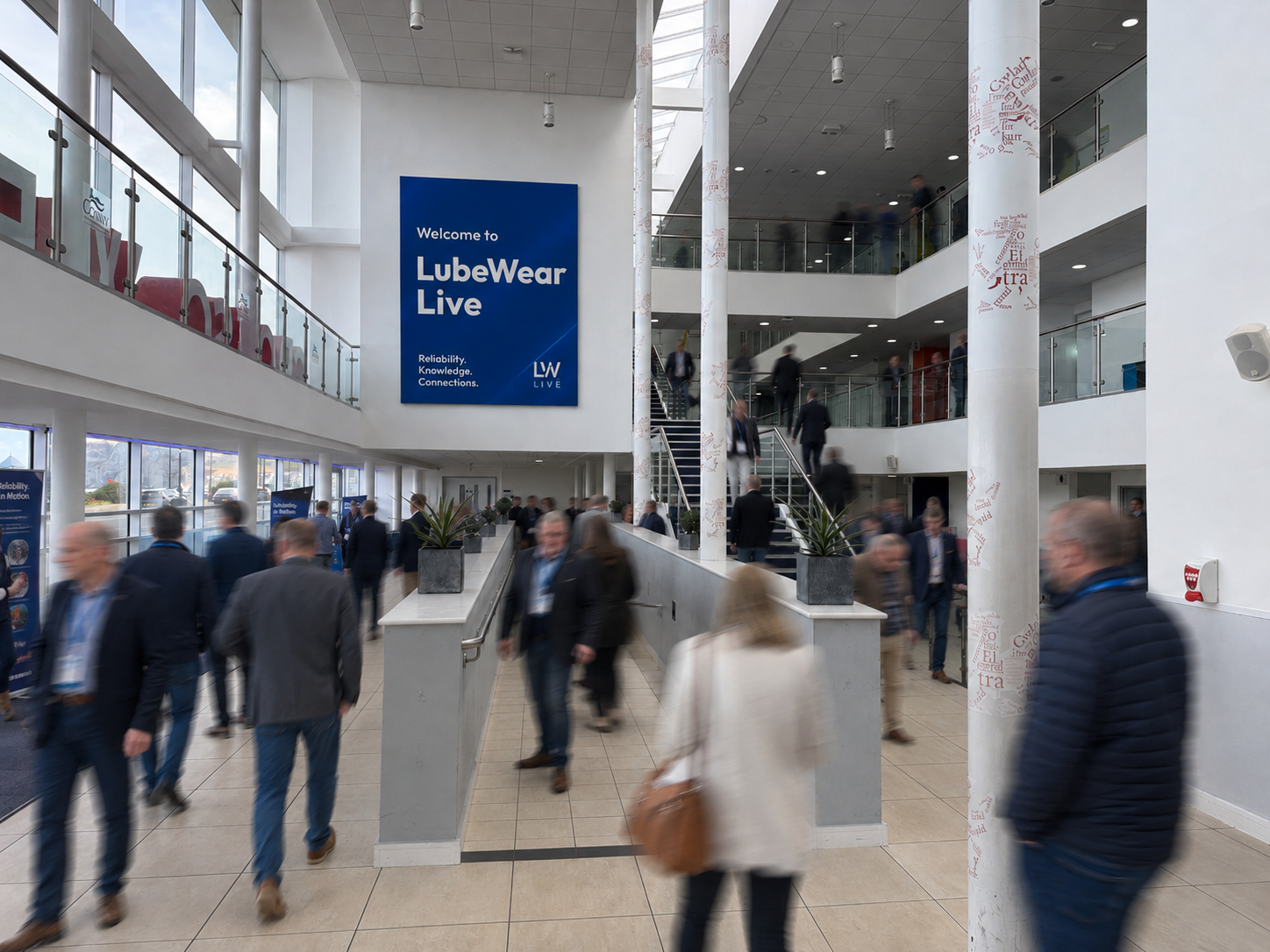 Sponsor banners and advertising in the busy venue atrium